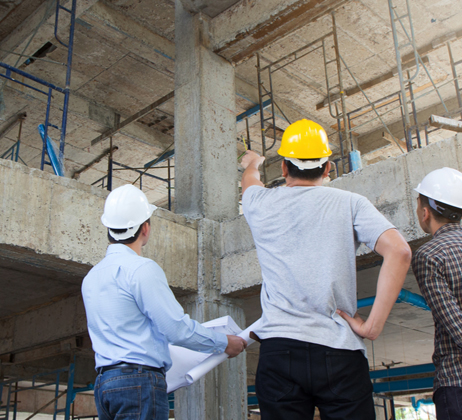 Engineering team reviewing plans